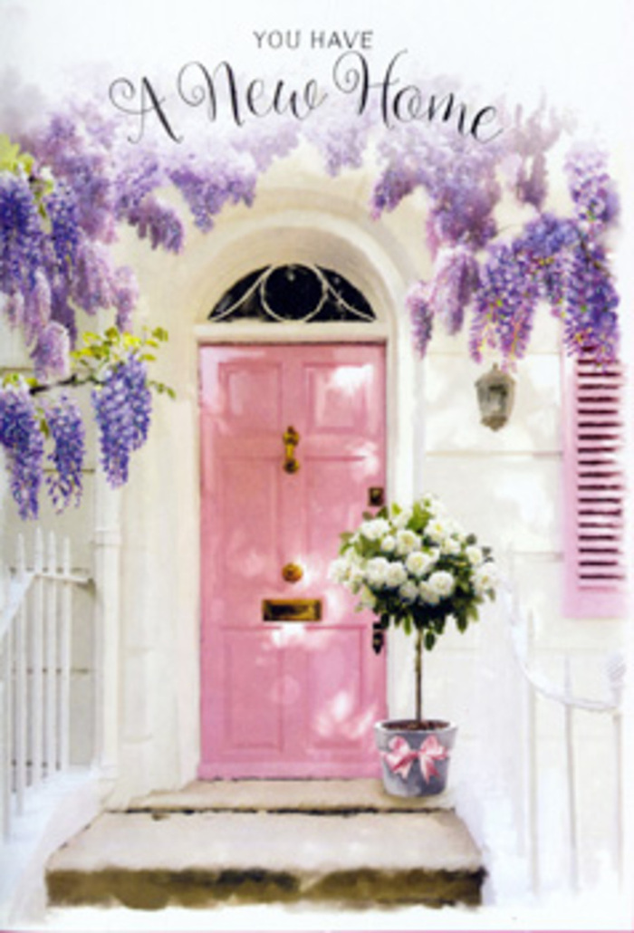 A charming Bromley doorstep is transformed into a poetic welcome, where flowers and colour work together to tell the story of a new home. A pale pink front door, brushed in a soft, chalky blush, forms the gentle centrepiece, its hue echoed in a nearby shutter and set against whitewashed walls that reflect the daylight. Above, lush cascades of wisteria drape down in long, violet-lavender clusters, adding movement and texture as they sway lightly and cast intricate shadows across the façade. Resting on the stone step beside the door, a grey tin bucket has been turned into an elegant floral display: an abundance of white and cream roses, their petals plush and velvety, rise in a generous dome, each bloom carefully angled by a florist's practiced hand. Slender stems of muted green foliage thread through the arrangement, giving a touch of garden freshness, while a blush satin ribbon tied around the bucket's base completes the composition with a note of understated romance. The lighting evokes a gentle afternoon in Bromley, perhaps after a visit to the local market, with sunshine filtering softly across the scene and leaving the doorway bathed in a mellow glow. You can almost breathe in the fragrance that would linger here-the sweet, slightly powdery scent of wisteria mingling with the rich, creamy aroma of roses-to create a comforting embrace of perfume each time the door opens. This setting feels especially suited to a housewarming delivery across Bromley, Keston, or Chislehurst, embodying the hope, gratitude, and quiet joy that accompany settling into a new space and calling it home.